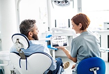 dentist explaining X-ray to patient 